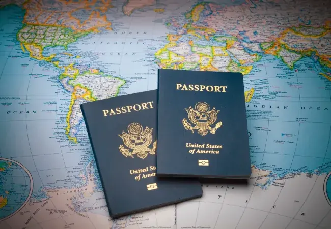 Two passports resting on a world map